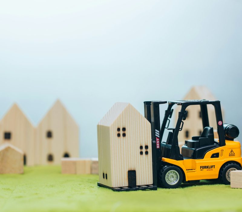 wooden small home with forklift car for moving house or home building renovation for good community